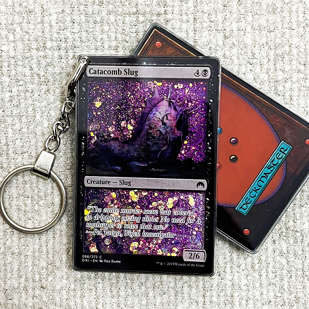 Catacomb Slug Card Quicksand Keychain
